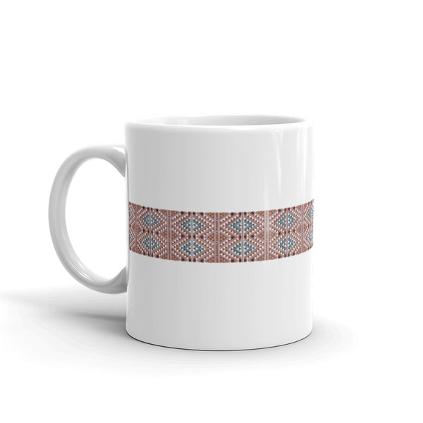 Mug, ceramic, featuring a textile motif from North Africa based upon a wood cut, white