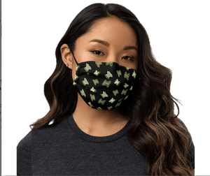 Face mask featuring a pattern of butterflies of ancient Mexican origin, olive