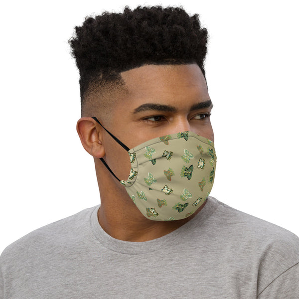 Face mask featuring a pattern of butterflies of ancient Mexican origin, olive